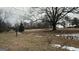 Spacious yard with a large tree, promising shade and tranquility in a natural setting at 1597 Highway 92 S, Fayetteville, GA 30215
