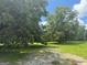 Expansive yard with mature trees, offering shade and a natural setting to the property at 1597 Highway 92 S, Fayetteville, GA 30215