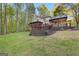 House with a large deck, screened porch, and pergola at 150 S Kite Lake Rd, Fayetteville, GA 30214
