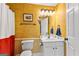 Basement bathroom with white vanity and gold-patterned walls at 150 S Kite Lake Rd, Fayetteville, GA 30214