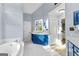 Elegant bathroom with blue vanity and tile flooring at 150 S Kite Lake Rd, Fayetteville, GA 30214