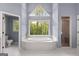 Luxurious bathroom with a large soaking tub and walk-in shower at 150 S Kite Lake Rd, Fayetteville, GA 30214