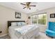 Spacious bedroom with large windows and a ceiling fan at 150 S Kite Lake Rd, Fayetteville, GA 30214