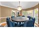 Formal dining room featuring a round table and crystal chandelier at 150 S Kite Lake Rd, Fayetteville, GA 30214