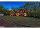 Brick home with a large, grassy front yard and attached garage at 150 S Kite Lake Rd, Fayetteville, GA 30214