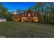 Brick two-story home with a large front yard and attached garage at 150 S Kite Lake Rd, Fayetteville, GA 30214