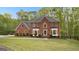 Two-story brick house with a nicely landscaped yard at 150 S Kite Lake Rd, Fayetteville, GA 30214