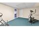 Simple basement gym, with an elliptical and inversion table at 150 S Kite Lake Rd, Fayetteville, GA 30214