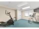 Basement home gym with elliptical and inversion table at 150 S Kite Lake Rd, Fayetteville, GA 30214