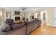 Spacious living room with sectional sofa, fireplace, and hardwood floors at 150 S Kite Lake Rd, Fayetteville, GA 30214