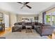Spacious living room featuring a large sectional sofa and hardwood floors at 150 S Kite Lake Rd, Fayetteville, GA 30214