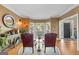 Sunlit sitting room with two armchairs and a large mirror at 150 S Kite Lake Rd, Fayetteville, GA 30214