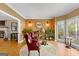 Bright sitting room with bay windows, hardwood floors, and comfortable seating at 150 S Kite Lake Rd, Fayetteville, GA 30214