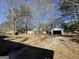 Large backyard with detached garage and mature trees at 730 N Carter Dr, Jonesboro, GA 30236