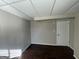 Finished basement room with dark hardwood floors and a door at 730 N Carter Dr, Jonesboro, GA 30236
