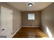 Small bedroom with hardwood floors and closet at 730 N Carter Dr, Jonesboro, GA 30236