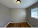 Small bedroom with hardwood floors and window at 730 N Carter Dr, Jonesboro, GA 30236