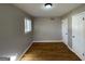 Bright bedroom with hardwood floors and ample closet space at 730 N Carter Dr, Jonesboro, GA 30236