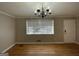 Simple dining room with hardwood floors and chandelier at 730 N Carter Dr, Jonesboro, GA 30236
