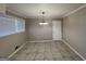 Simple dining room with tile floors and chandelier at 730 N Carter Dr, Jonesboro, GA 30236