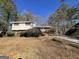 Brick ranch home with carport and mature trees at 730 N Carter Dr, Jonesboro, GA 30236