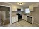 Kitchen with white cabinets, stainless steel appliances at 730 N Carter Dr, Jonesboro, GA 30236