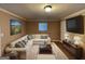 Cozy living room, featuring a large sectional sofa and built-in shelving at 730 N Carter Dr, Jonesboro, GA 30236