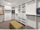 Spacious walk-in closet with custom shelving, drawers, and ample storage space at 200 Simonton Rd, Lawrenceville, GA 30046