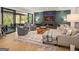 The open living room boasts a linear fireplace and large windows, creating a cozy and stylish space at 200 Simonton Rd, Lawrenceville, GA 30046