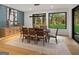 Elegant dining room with natural light, views of the yard, and modern decor with seating for eight at 200 Simonton Rd, Lawrenceville, GA 30046