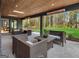 Outdoor patio with comfortable seating, heaters, and a beautiful view of the expansive backyard at 200 Simonton Rd, Lawrenceville, GA 30046