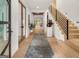 A modern foyer with sleek staircase and natural wood flooring provides a grand entrance at 200 Simonton Rd, Lawrenceville, GA 30046
