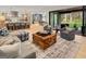 Open-concept living room with access to the outdoor patio, features wood flooring and contemporary decor at 200 Simonton Rd, Lawrenceville, GA 30046