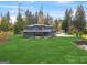 Stunning exterior elevation of a modern home with lush green lawn and mature trees at 200 Simonton Rd, Lawrenceville, GA 30046