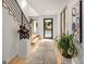 The bright foyer features modern staircase and accent lighting, creating a welcoming entry at 200 Simonton Rd, Lawrenceville, GA 30046