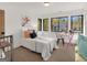 Bright bedroom with a large window, sleek desk, and stylish decor creating a cozy and inviting atmosphere at 200 Simonton Rd, Lawrenceville, GA 30046