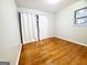 Bedroom with hardwood floors and white curtains at 485 Evergreen Dr, Forest Park, GA 30297