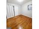 Bedroom with hardwood floors and white curtains at 485 Evergreen Dr, Forest Park, GA 30297