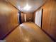 Simple bedroom with wood paneling and linoleum floors at 485 Evergreen Dr, Forest Park, GA 30297