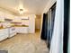 Kitchen with white cabinets and tile floors at 485 Evergreen Dr, Forest Park, GA 30297