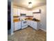 Kitchen with white cabinets and tile floors at 485 Evergreen Dr, Forest Park, GA 30297