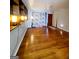 Living room with hardwood floors and built-in shelving at 485 Evergreen Dr, Forest Park, GA 30297
