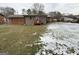 Large backyard with light snow coverage at 6148 Park Dr, Forest Park, GA 30297