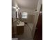 Functional bathroom with tiled walls, single sink vanity, and bathtub shower combo at 6148 Park Dr, Forest Park, GA 30297