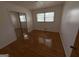 Bedroom with wood floors and mirrored closet at 6148 Park Dr, Forest Park, GA 30297