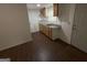 Efficient kitchen with wood cabinets, granite countertops, and stainless steel sink at 6148 Park Dr, Forest Park, GA 30297