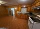 Kitchen featuring wood cabinetry and laminate countertops at 6148 Park Dr, Forest Park, GA 30297