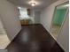 An open-concept area with wood-look tile flooring and a kitchenette at 6148 Park Dr, Forest Park, GA 30297