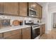 Stainless steel appliances and light countertops in the kitchen at 753 Myrica Ave, Locust Grove, GA 30248