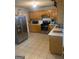 Kitchen with stainless steel appliances and light wood cabinets at 2658 Deann Dr, Ellenwood, GA 30294